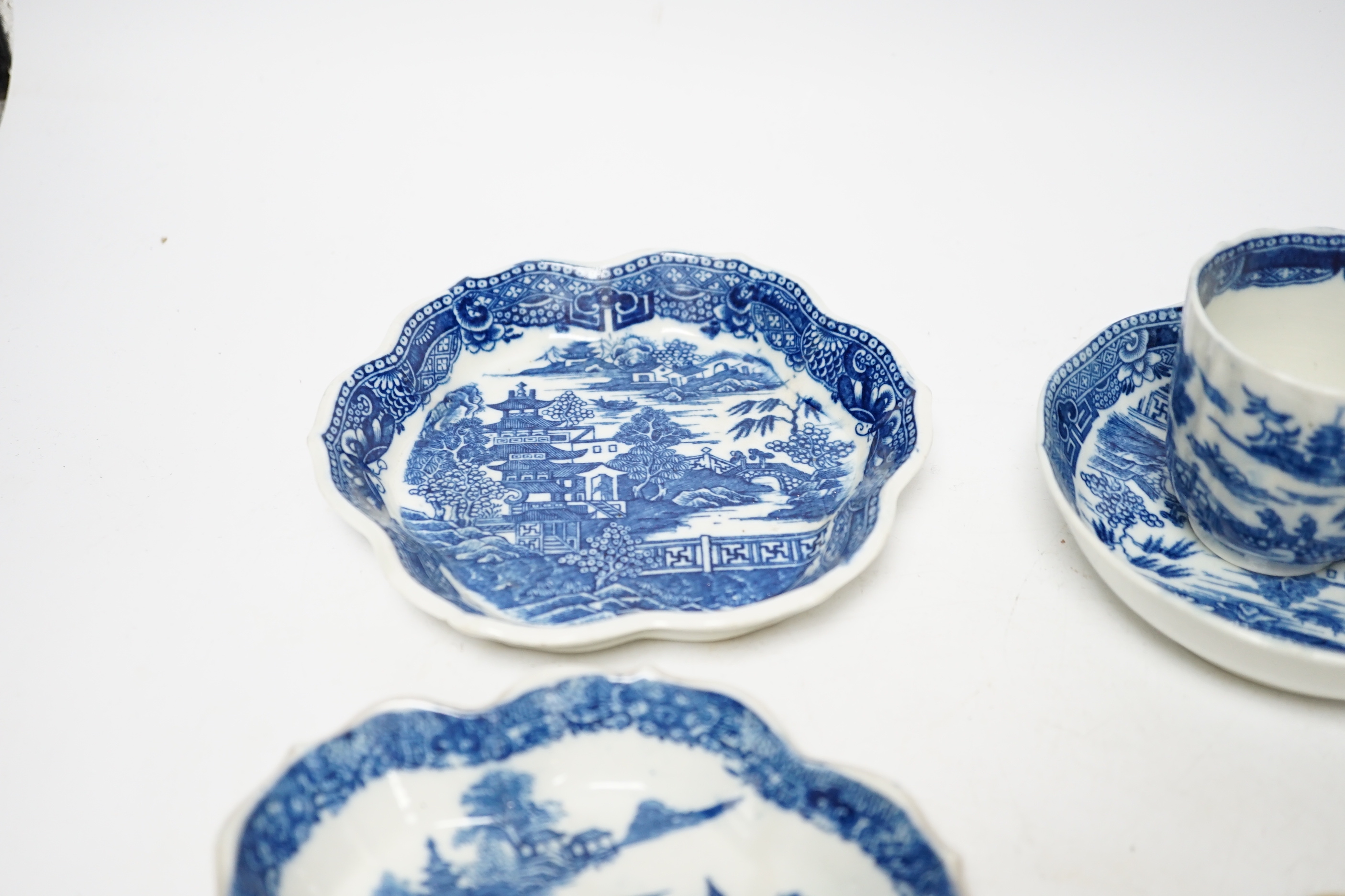 A group of Caughley pagoda pattern table wares, late 18th century, including two teapot stands, a coffee cup and saucer and a spoon tray